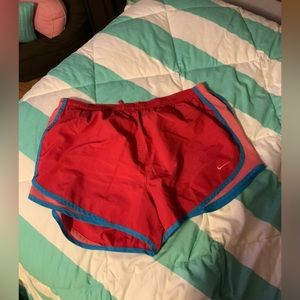 Pink Nike running shorts
